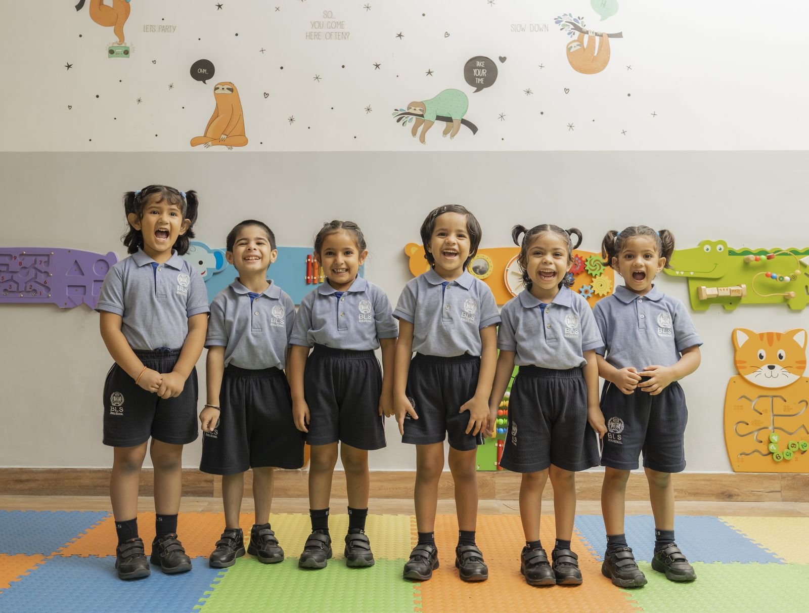 Young students of our school client, smiling in uniform